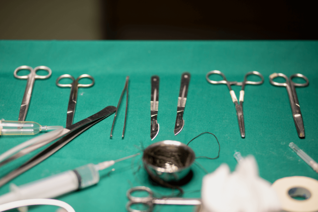 Veterinary surgical instruments cleaned by enzymatic instrument cleaners